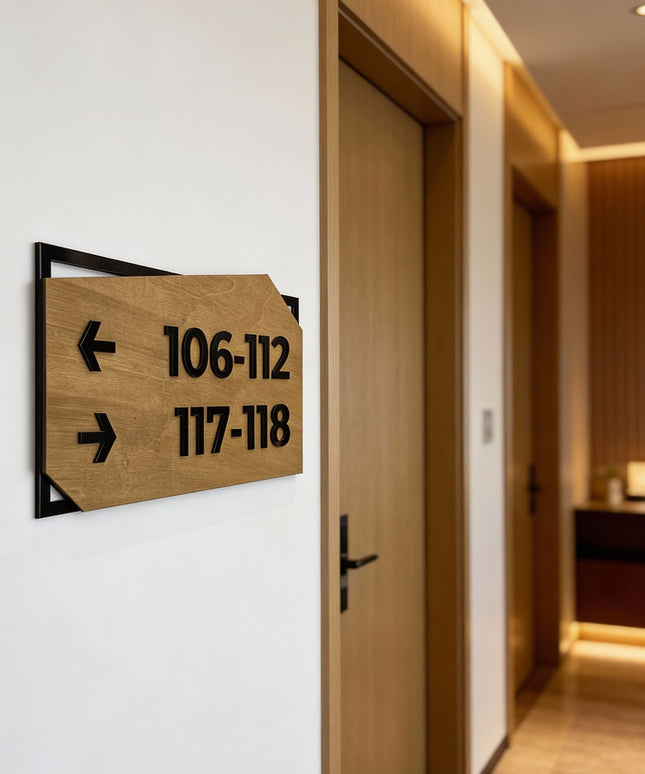 Modern personalized wayfinding sign by ALUMADESIGNCO combining birch wood plaque and black acrylic text, premium directional signage for hotels, offices, and contemporary interiors