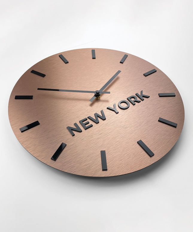Brushed bronze world time zone wall clock by ALUMADESIGNCO featuring multiple city name plaques, elegant wall clock for offices, reception areas, and modern spaces