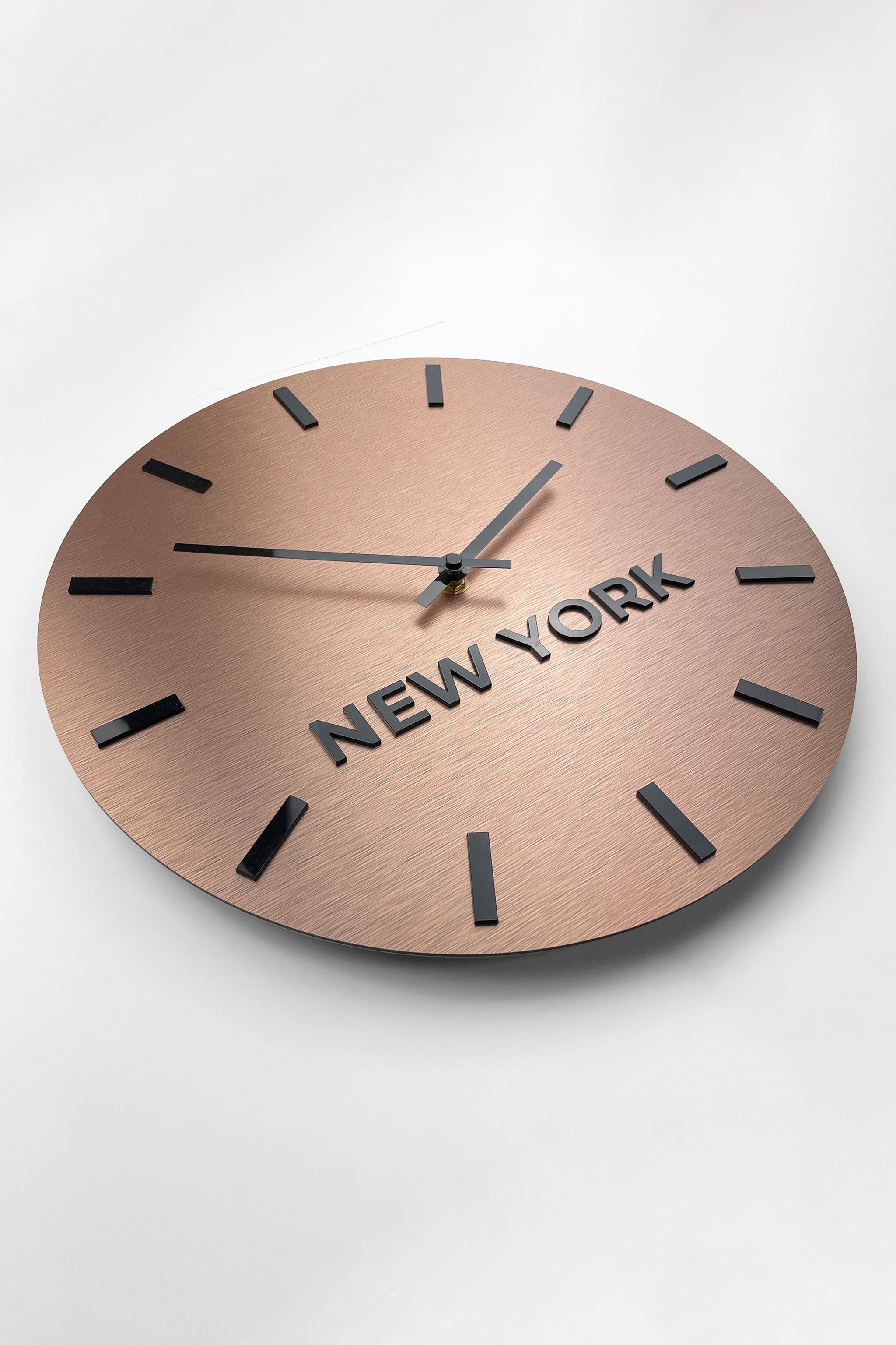 Brushed bronze world time zone wall clock by ALUMADESIGNCO featuring multiple city name plaques, elegant wall clock for offices, reception areas, and modern spaces