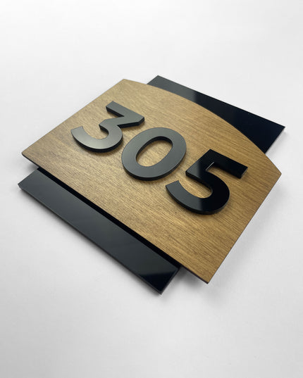 Premium custom door number sign by ALUMADESIGNCO combining natural birch wood and black acrylic glass numbers, modern Scandinavian door signage for hotels, offices, and apartments