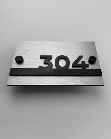 Modern Horizon hotel room number sign by ALUMADESIGNCO featuring brushed metal panel and black acrylic numbers, standoff mounted wall plaque for hotel corridors and apartments