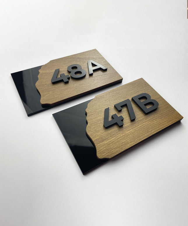 Custom Fusion apartment door number sign by ALUMADESIGNCO featuring wood base and acrylic numbers, modern door plaque for apartments and contemporary interiors