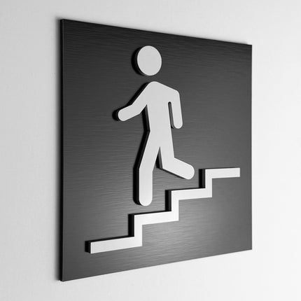 ALUMADESIGNCO stairwell sign downstairs with modern directional style, premium wayfinding signage for offices, hotels, apartments, and commercial interiors