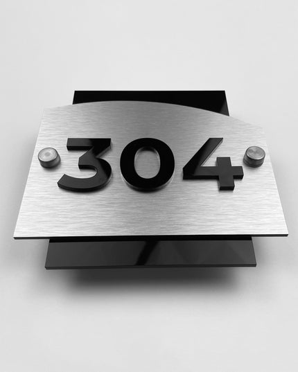 Premium Flow Design hotel room number sign by ALUMADESIGNCO featuring brushed silver metal base and black acrylic 3D numbers, stylish door plaque for hotels