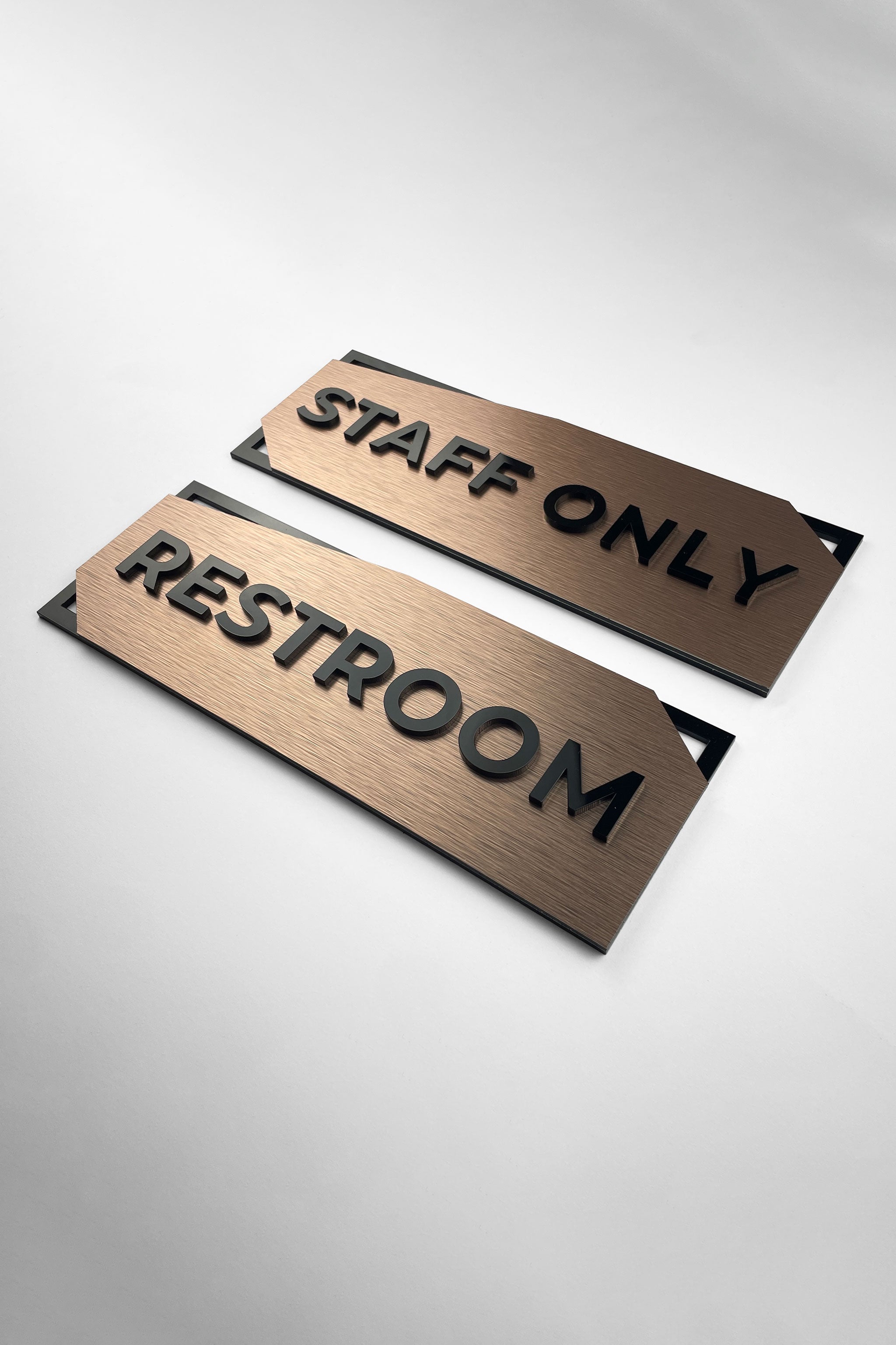 Modern 3D layered office door sign by ALUMADESIGNCO combining bronze metal panel and acrylic lettering, stylish signage for offices and interior spaces