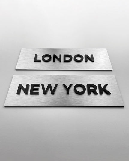 Custom brushed silver door sign with black acrylic lettering by ALUMADESIGNCO, elegant plaque for offices, meeting rooms, and contemporary interiors