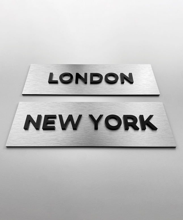 Custom brushed silver door sign with black acrylic lettering by ALUMADESIGNCO, elegant plaque for offices, meeting rooms, and contemporary interiors