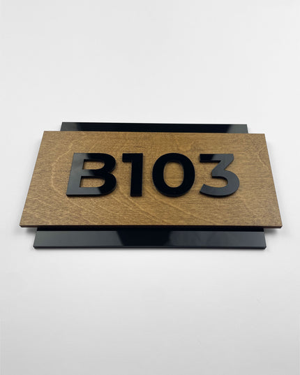 Custom birch wood and acrylic room number sign by ALUMADESIGNCO featuring natural wood base and raised acrylic numbers for modern hotel rooms and apartment doors