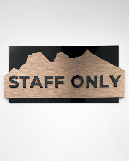 Modern custom door sign by ALUMADESIGNCO combining brushed bronze metal panel and raised black acrylic lettering, stylish signage for interiors