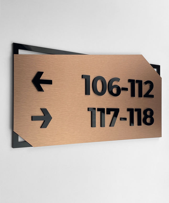 Premium directional wall sign by ALUMADESIGNCO featuring brushed bronze plaque and black acrylic lettering, modern signage for hospitality, office, and residential interiors