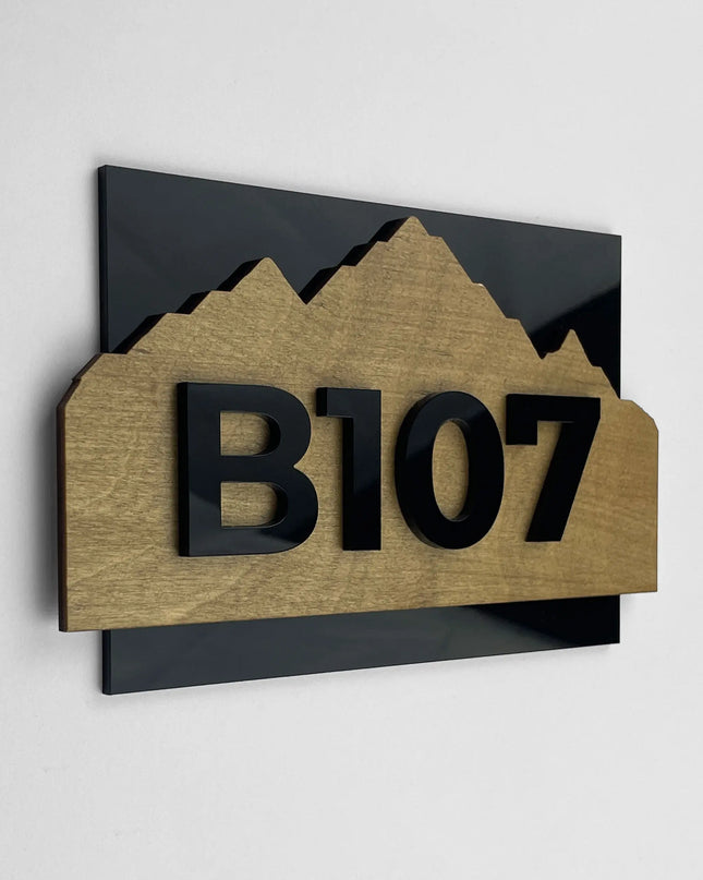 ALUMADESIGNCO wood and acrylic hotel room number sign Alpine Design with minimalist Scandinavian style, birch wood background and black acrylic 3D numbers for modern hotel and Airbnb door signage