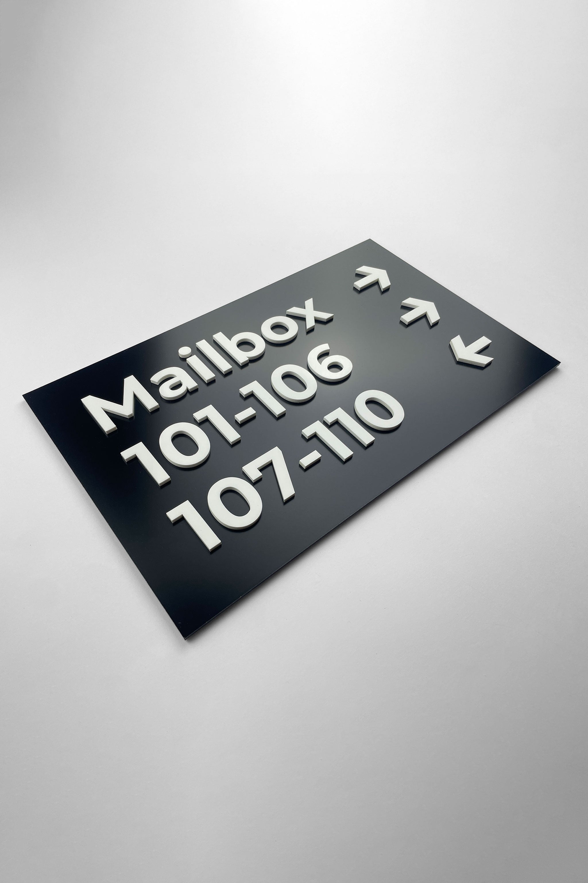 Premium Modern black and white directional wall plaque by ALUMADESIGNCO, stylish wayfinding signage for lobbies, hallways, offices, and hospitality interiors