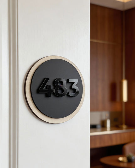ALUMADESIGNCO round hotel room number sign made from natural birch wood and black acrylic glass numbers, modern wood and acrylic door plaque for hotels, apartments, and boutique hospitality interiors