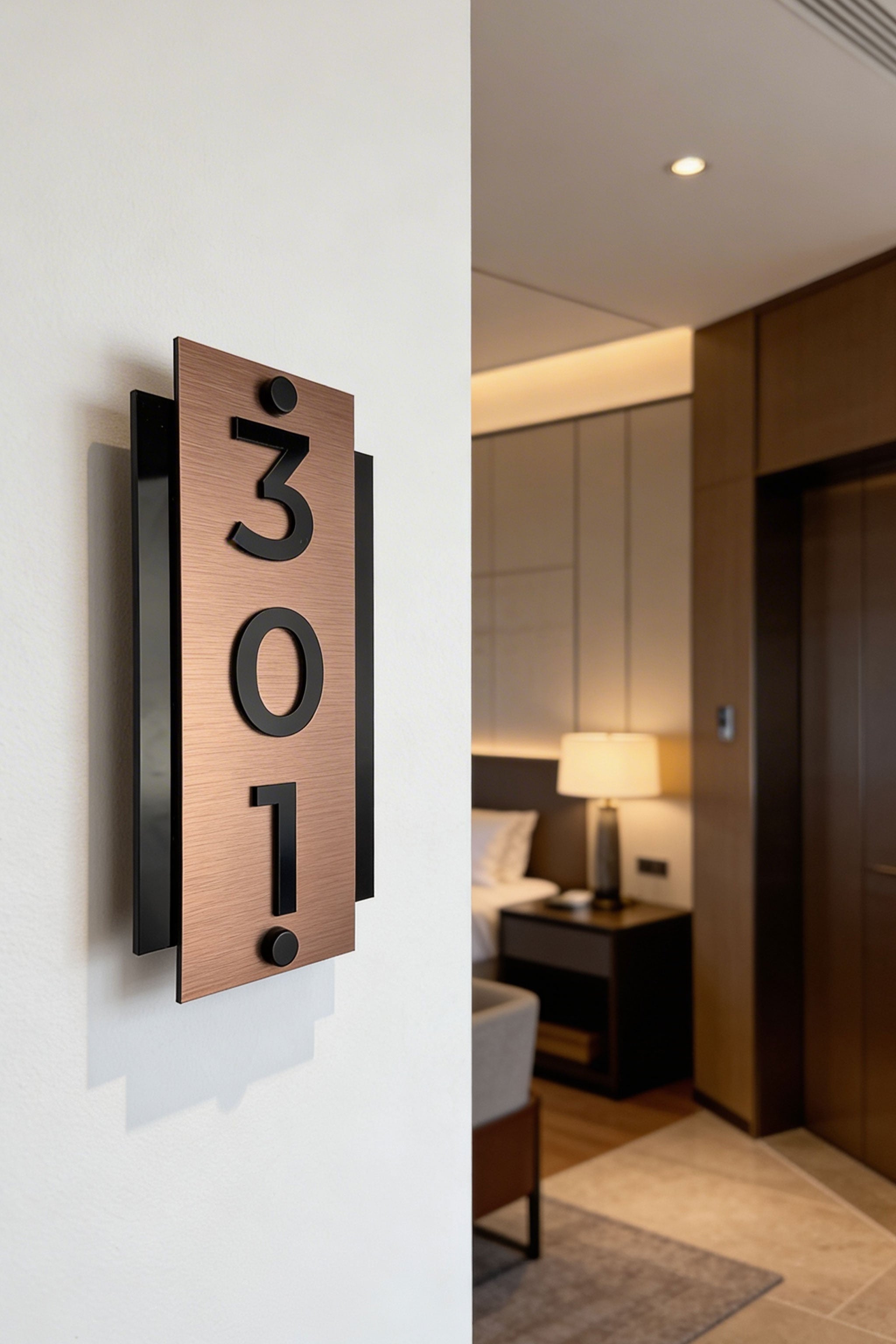 ALUMADESIGNCO vertical brushed bronze standoff hotel room number sign with raised black acrylic numbers, modern door signage for boutique hotels and apartment interiors