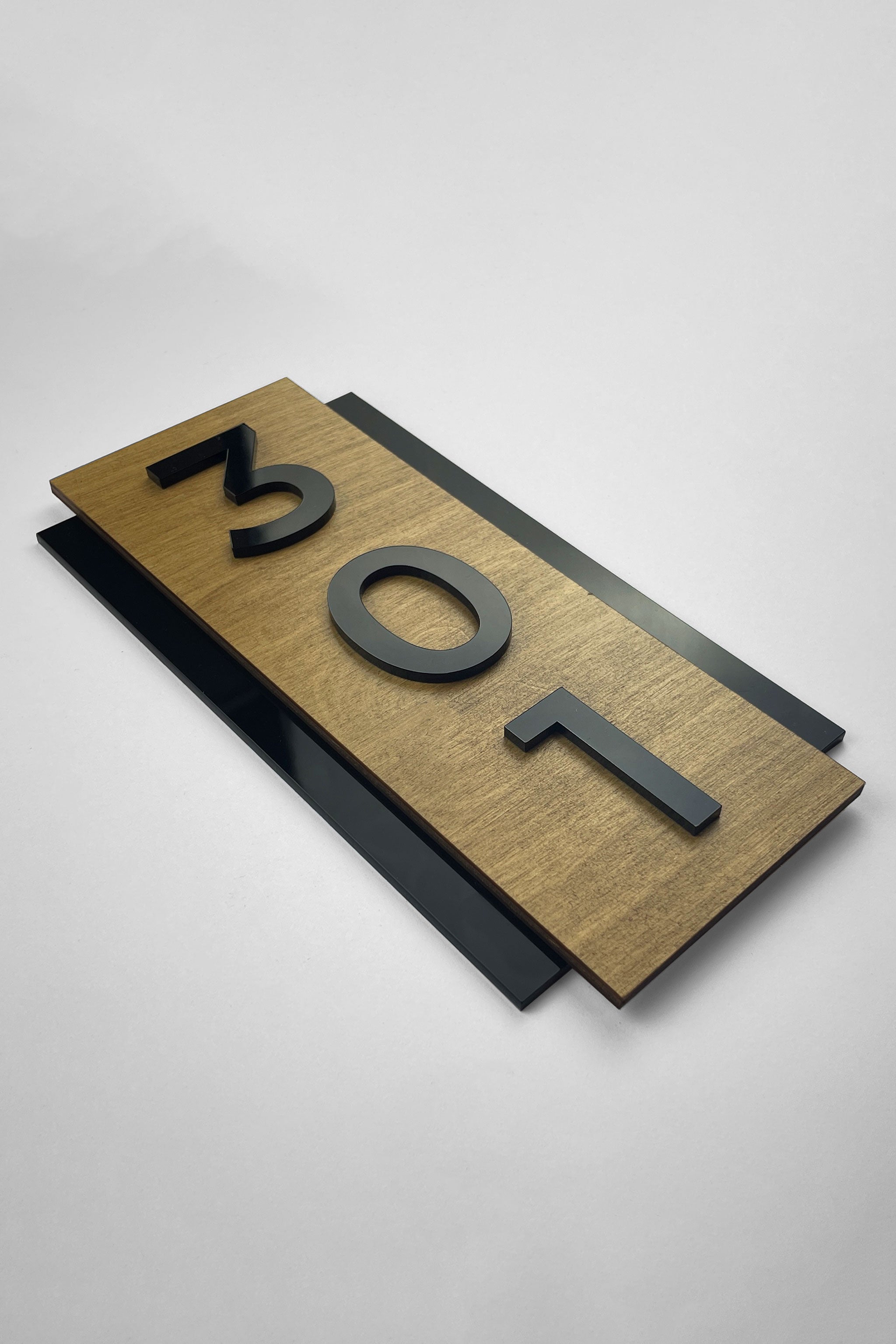 ALUMADESIGNCO modern vertical wood and black acrylic hotel room number sign with minimalist Scandinavian design, elegant door number plaque for hotels, Airbnb properties, and contemporary interiors