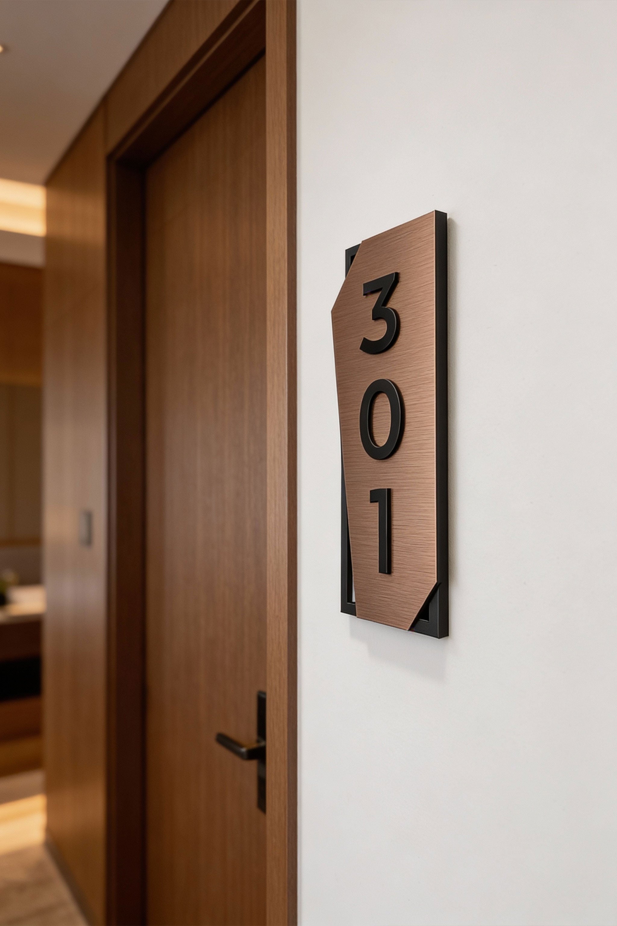 ALUMADESIGNCO vertical brushed bronze door number sign with black acrylic characters, premium modern hotel room signage for hospitality interiors and apartment corridors