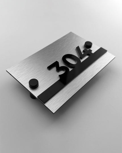 ALUMADESIGNCO Horizon Design standoff hotel room number plaque with raised black acrylic characters, modern wall signage for boutique hotels, offices, and hospitality interiors