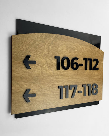 ALUMADESIGNCO birch wood and black acrylic arrow wayfinding sign in Flow Design with elegant modern style, directional signage for offices, hotels, apartments, and interior spaces