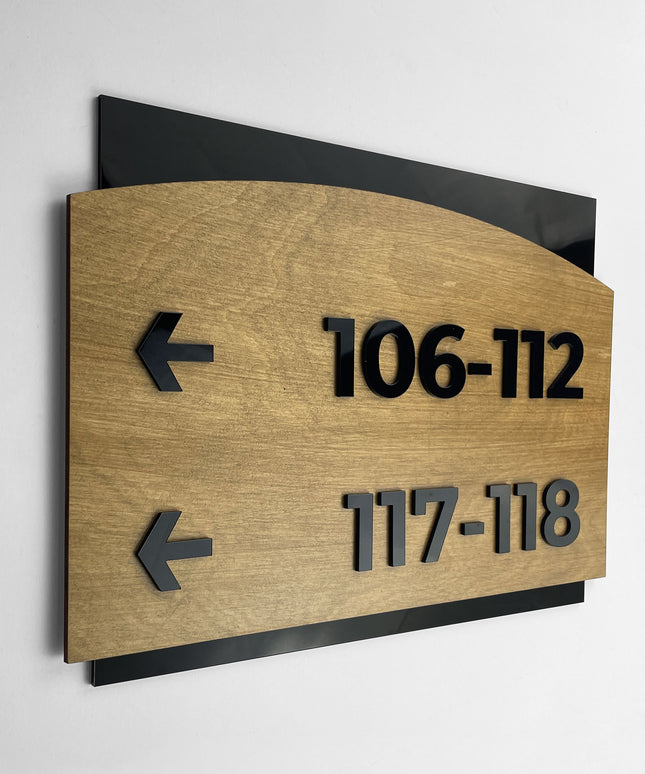 ALUMADESIGNCO birch wood and black acrylic arrow wayfinding sign in Flow Design with elegant modern style, directional signage for offices, hotels, apartments, and interior spaces