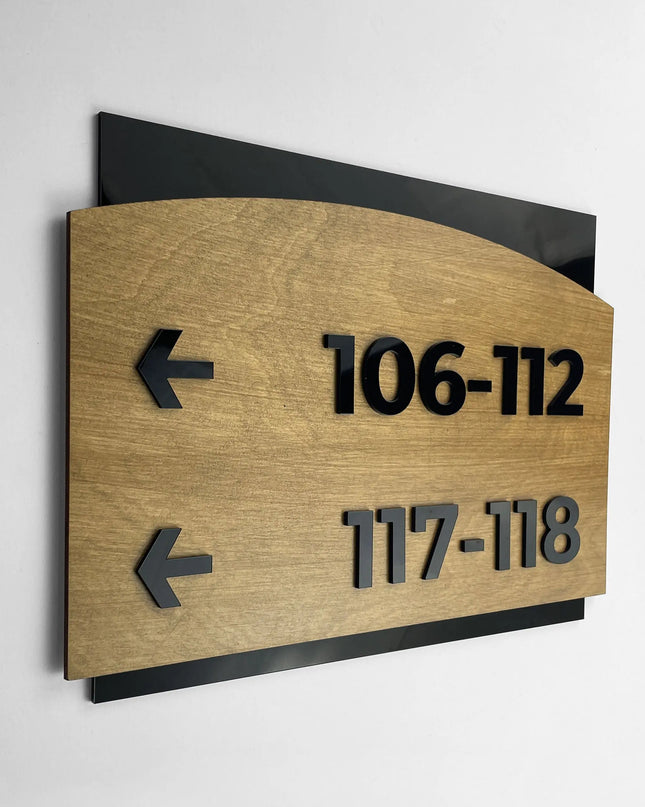ALUMADESIGNCO birch wood and black acrylic arrow wayfinding sign in Flow Design with elegant modern style, directional signage for offices, hotels, apartments, and interior spaces