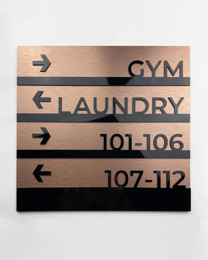 Modern Bronze wayfinding sign by ALUMADESIGNCO featuring premium wall plaque design, elegant directional signage for hotels, offices, and contemporary interiors