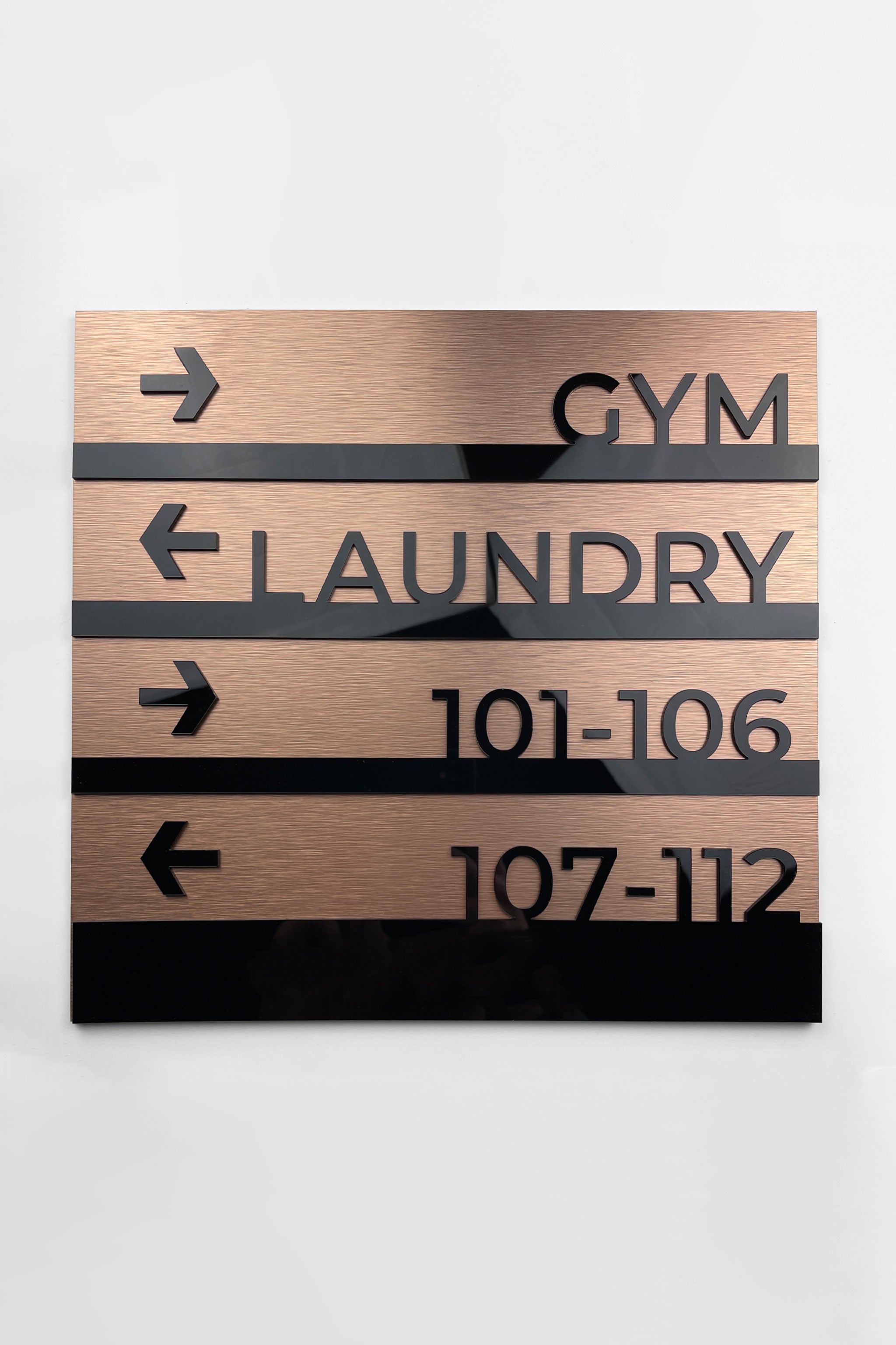 Modern Bronze wayfinding sign by ALUMADESIGNCO featuring premium wall plaque design, elegant directional signage for hotels, offices, and contemporary interiors