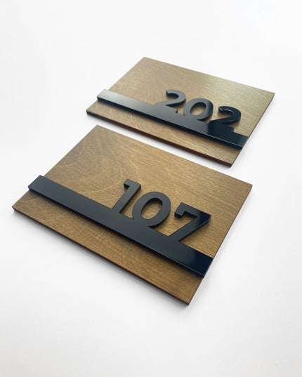 Modern Horizon Design wooden apartment door number sign by ALUMADESIGNCO with natural wood panel and raised glossy black acrylic numbers, stylish door signage