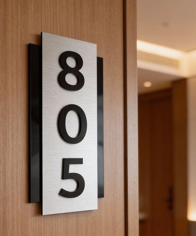 ALUMADESIGNCO modern brushed silver room number sign with raised black acrylic numbers, vertical wall signage for hotels, apartments, and contemporary interiors