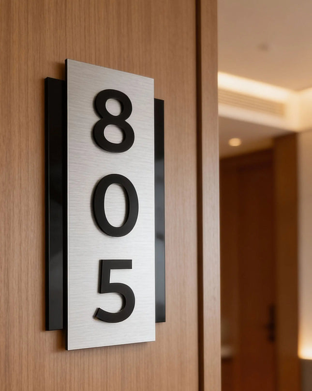 ALUMADESIGNCO modern brushed silver room number sign with raised black acrylic numbers, vertical wall signage for hotels, apartments, and contemporary interiors
