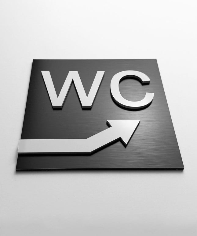 WC arrow upstairs sign by ALUMADESIGNCO, modern toilet direction plaque for hotels, offices, restaurants, and public interior spaces