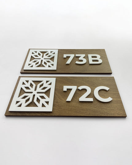 Wooden suite door number sign by ALUMADESIGNCO featuring birch wood base and white acrylic glass numbers, modern signage for hospitality interiors