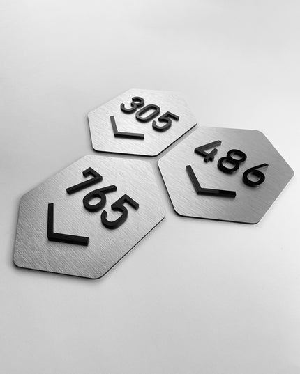 Custom silver and acrylic room number sign Hexagon Design by ALUMADESIGNCO featuring geometric style and raised acrylic numbers for hotel rooms and apartment doors