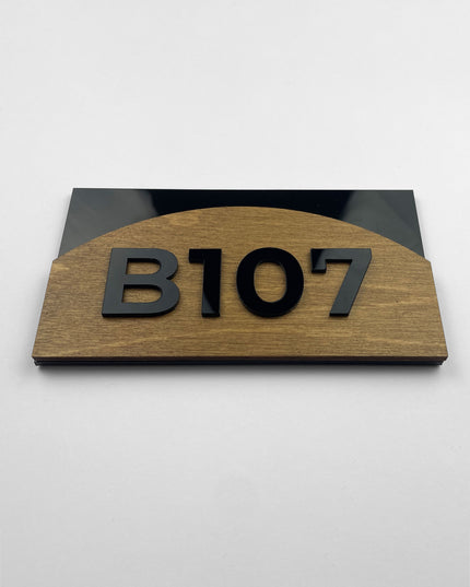 Modern Flow Design birch wood room number sign by ALUMADESIGNCO with acrylic glass numbers, stylish door signage for contemporary hotel and apartment interiors