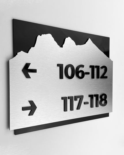 Brushed silver and black acrylic directional sign by ALUMADESIGNCO, elegant wayfinding plaque for hotels, offices, corridors, and contemporary interior spaces