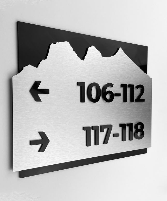 Brushed silver and black acrylic directional sign by ALUMADESIGNCO, elegant wayfinding plaque for hotels, offices, corridors, and contemporary interior spaces