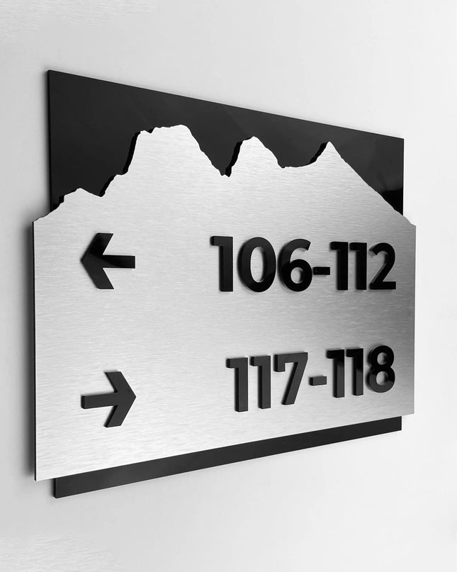 Brushed silver and black acrylic directional sign by ALUMADESIGNCO, elegant wayfinding plaque for hotels, offices, corridors, and contemporary interior spaces
