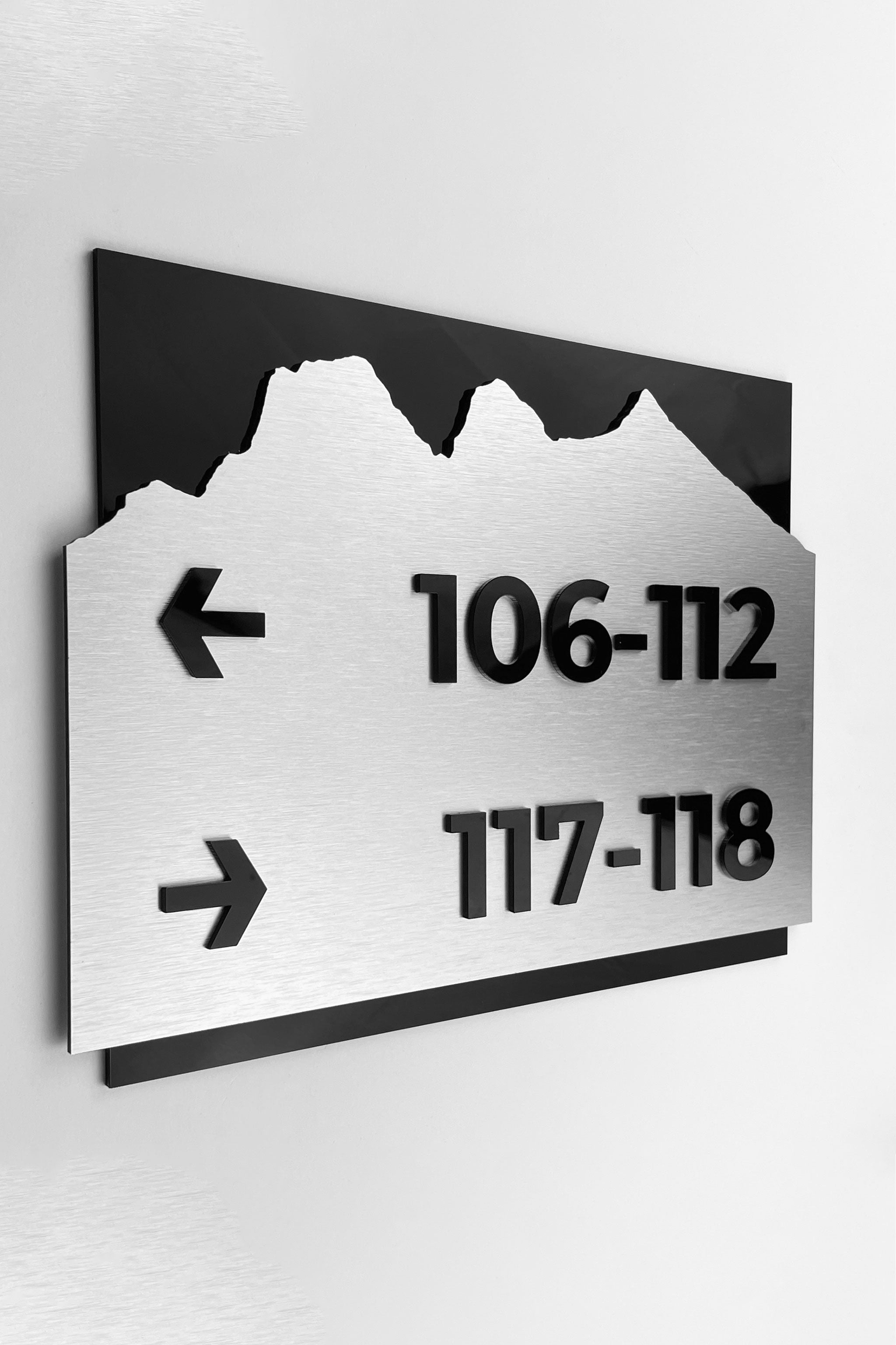 Brushed silver and black acrylic directional sign by ALUMADESIGNCO, elegant wayfinding plaque for hotels, offices, corridors, and contemporary interior spaces