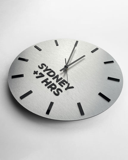 Modern brushed silver world time zone clock by ALUMADESIGNCO with personalized city names, stylish office wall clock for business interiors and hospitality spaces