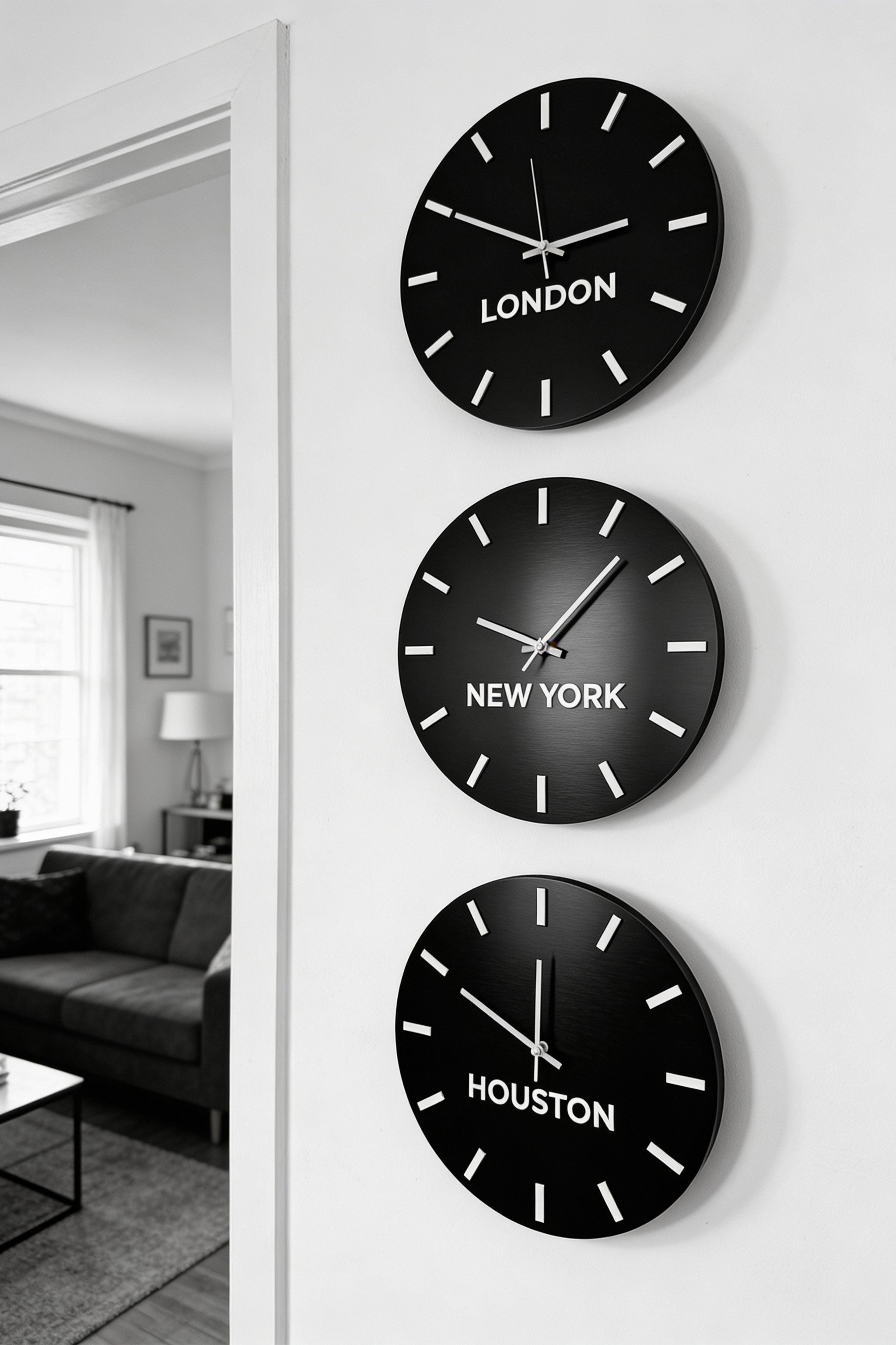 ALUMADESIGNCO personalized world time zone clock in brushed black and white acrylic glass, modern wall décor with custom city names for offices, hotels, studios, and contemporary interiors