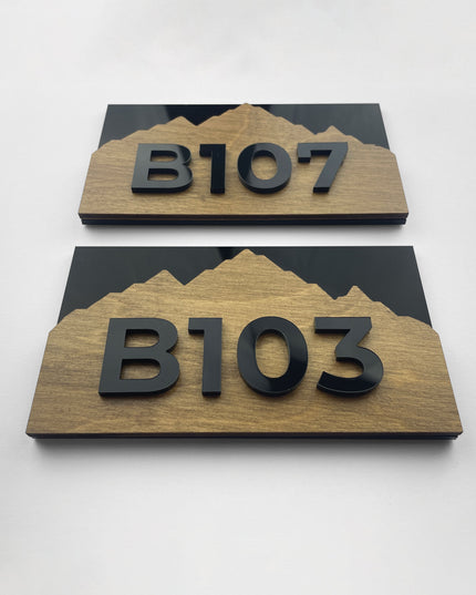 Modern Alpine Design apartment number sign by ALUMADESIGNCO combining wood and acrylic numbers, stylish door signage for apartments and hotel interiors