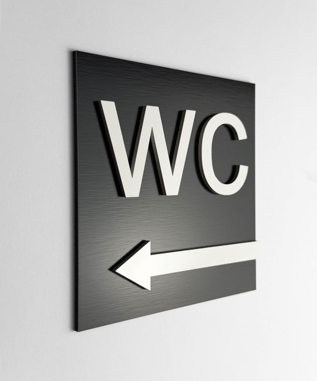 ALUMADESIGNCO WC arrow left sign with modern directional design, premium restroom wayfinding signage for offices, hotels, cafés, and commercial interiors