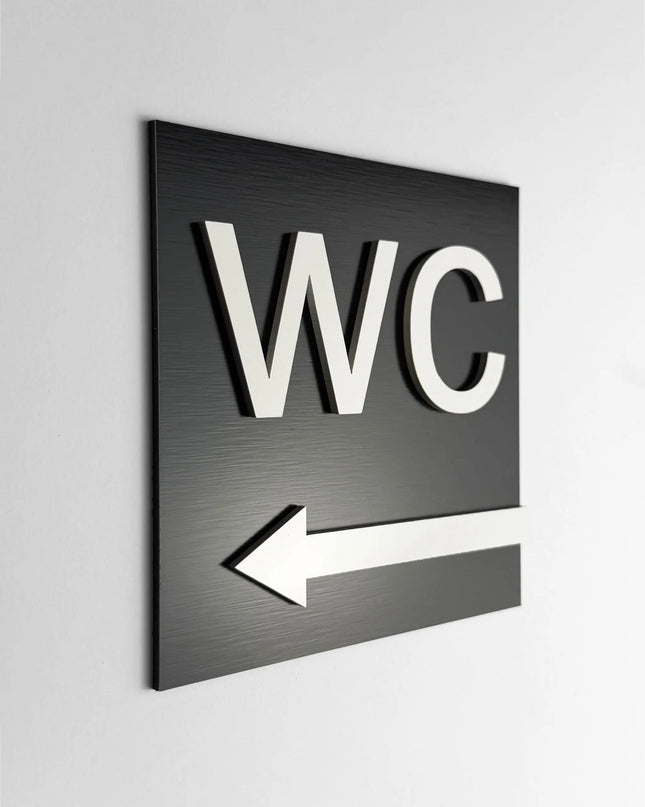 ALUMADESIGNCO WC arrow left sign with modern directional design, premium restroom wayfinding signage for offices, hotels, cafés, and commercial interiors