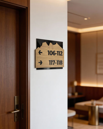 Modern Alpine Design wayfinding sign by ALUMADESIGNCO combining birch wood plaque and black acrylic text, premium directional signage for hotels, offices, and contemporary interiors