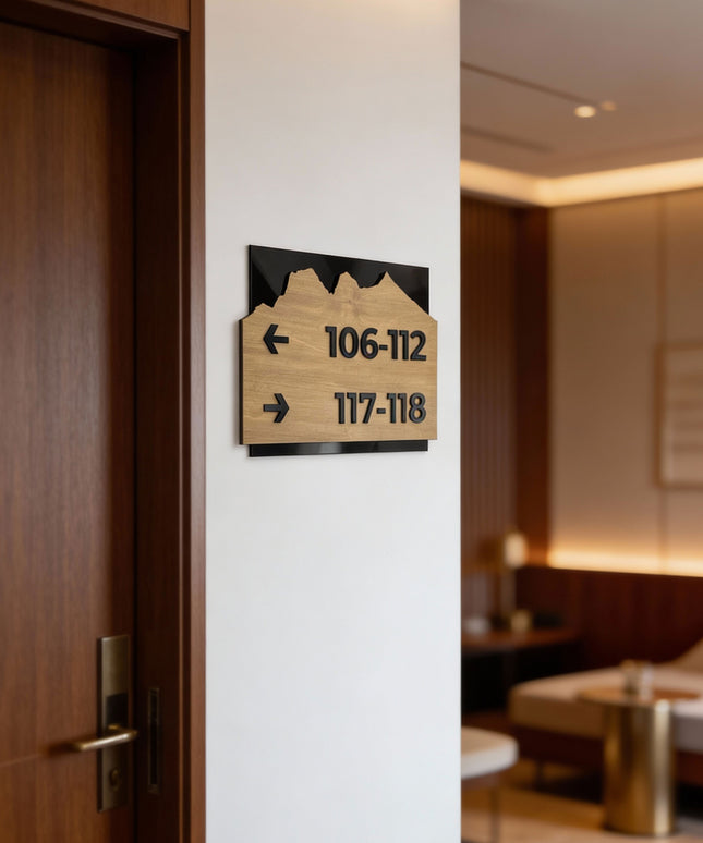 Modern Alpine Design wayfinding sign by ALUMADESIGNCO combining birch wood plaque and black acrylic text, premium directional signage for hotels, offices, and contemporary interiors