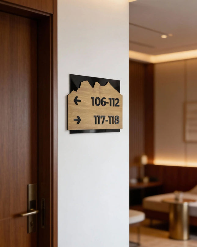 Modern Alpine Design wayfinding sign by ALUMADESIGNCO combining birch wood plaque and black acrylic text, premium directional signage for hotels, offices, and contemporary interiors