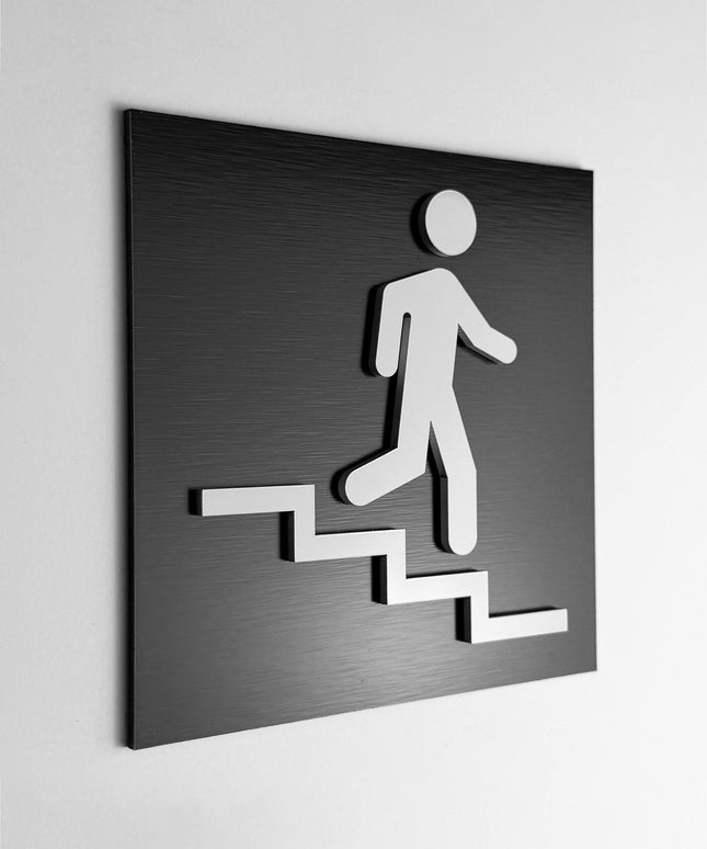ALUMADESIGNCO stair sign down right with modern directional arrow, premium wayfinding signage for offices, hotels, apartments, and commercial interiors