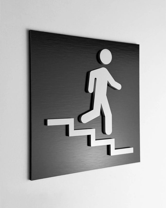 ALUMADESIGNCO stair sign down right with modern directional arrow, premium wayfinding signage for offices, hotels, apartments, and commercial interiors