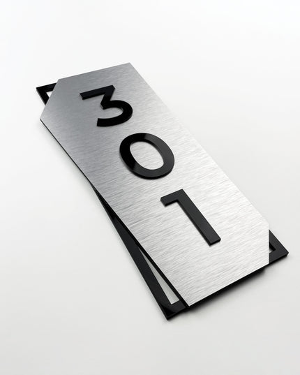 Modern vertical door number sign by ALUMADESIGNCO combining brushed silver metal panel and black acrylic glass numbers, elegant signage for contemporary interiors