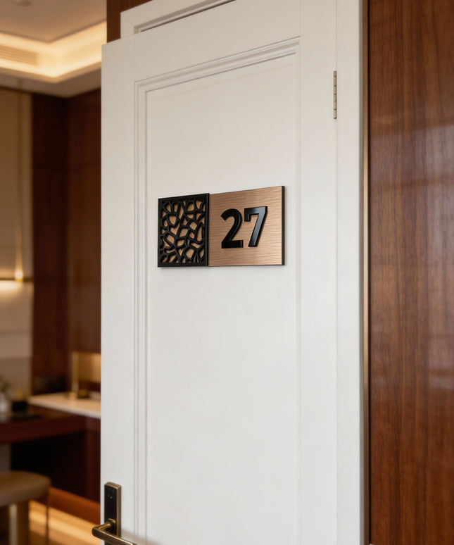 Modern designer door number sign by ALUMADESIGNCO combining brushed bronze metal panel and acrylic glass numbers, stylish signage for contemporary interiors