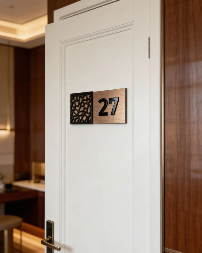 Modern designer door number sign by ALUMADESIGNCO combining brushed bronze metal panel and acrylic glass numbers, stylish signage for contemporary interiors